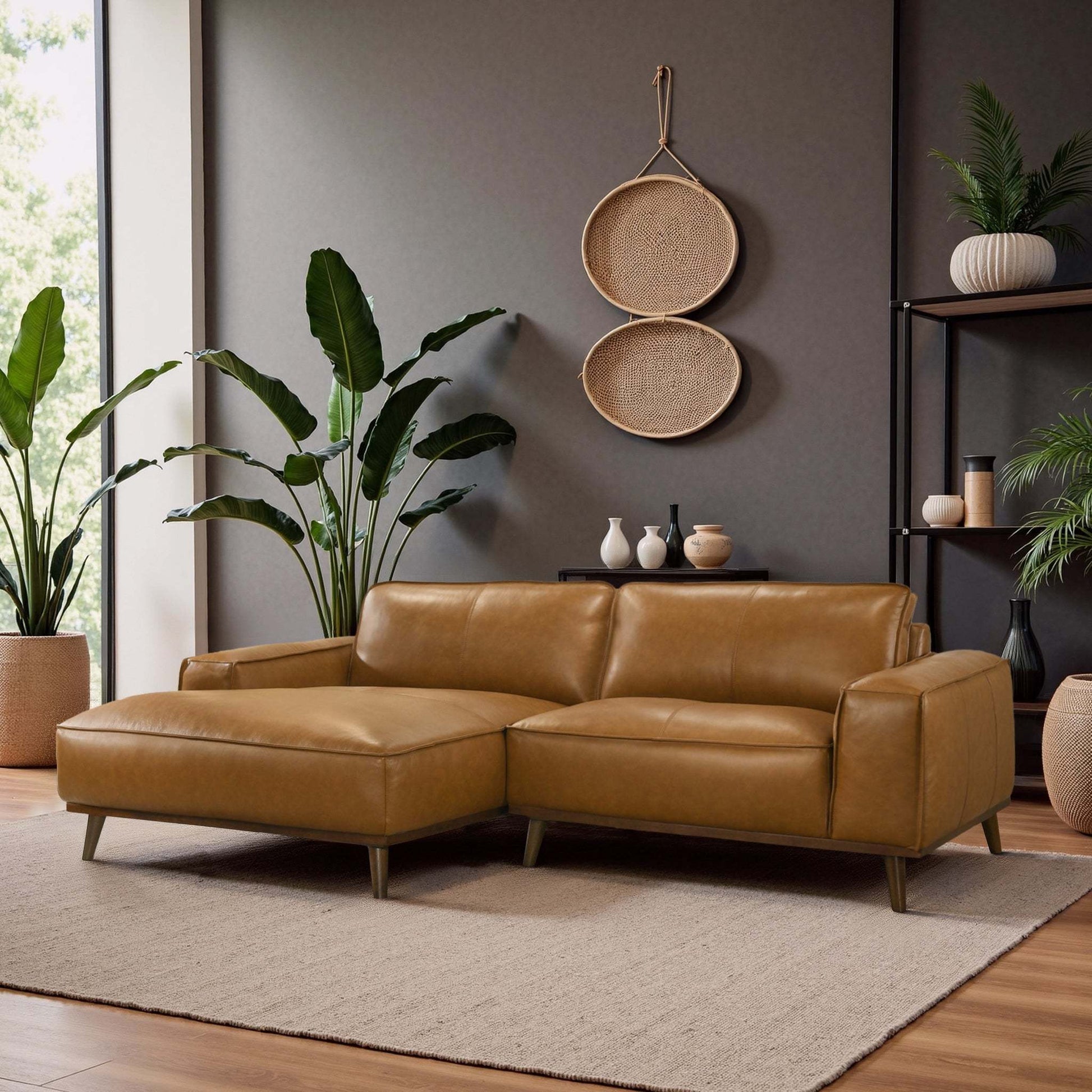 Modern tan sectional sofa in stylish living room with plants and woven wall decor, FredCo International furniture