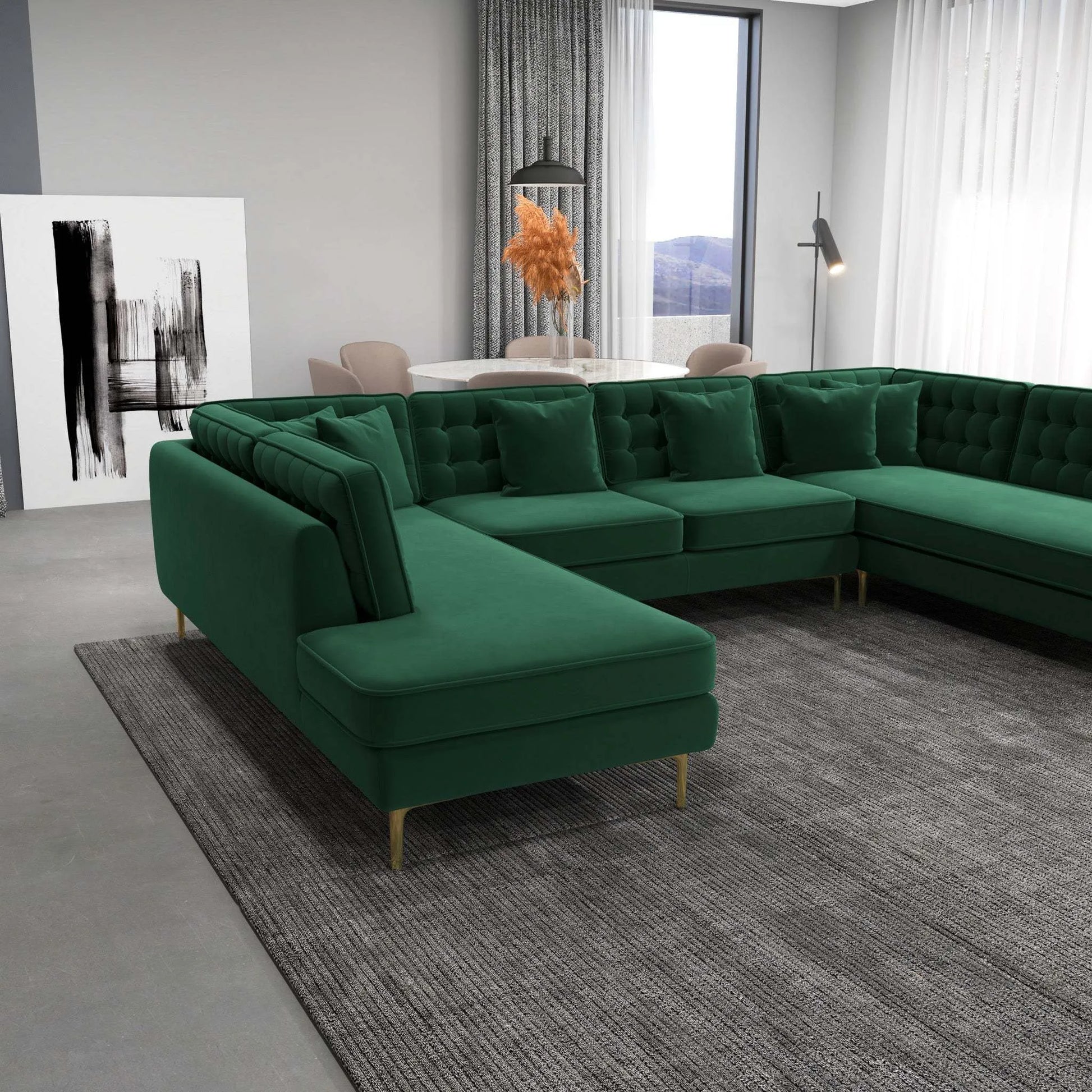 Modern living room with green velvet sectional sofa, gray rug, and dining area by FredCo International