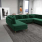 Modern living room with green velvet sectional sofa, gray rug, and dining area by FredCo International