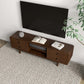 Modern wooden TV stand with drawers, decor, and books in a living room, FredCo International furniture.