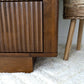 Mid-century modern wooden furniture on plush rug, textured cabinet, home decor at FredCo International