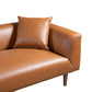 Modern tan leather sofa with matching pillow, contemporary furniture by FredCo International