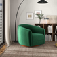 Modern green swivel accent chair in stylish living room with bookshelf and decor
