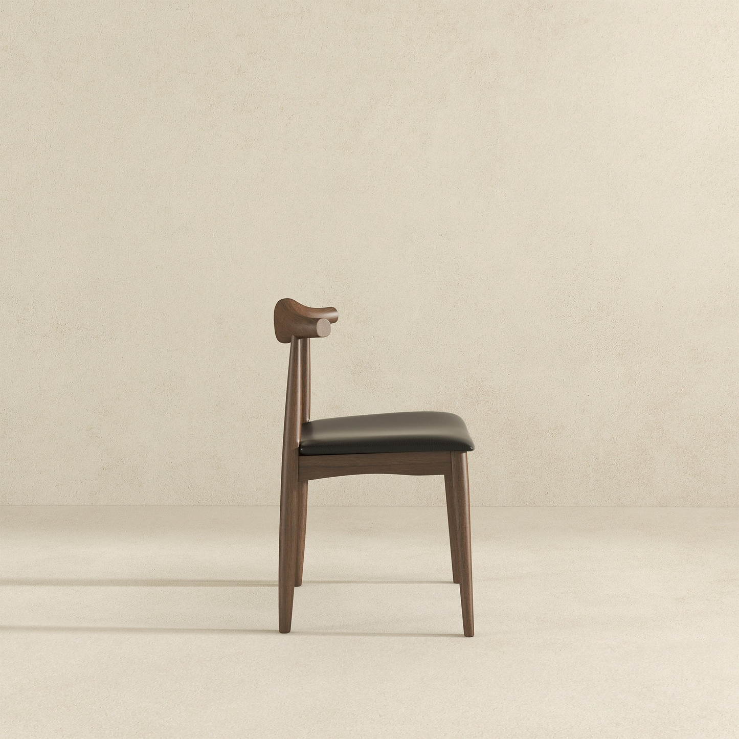 Modern wood dining chair with black cushion on neutral background, FredCo International furniture