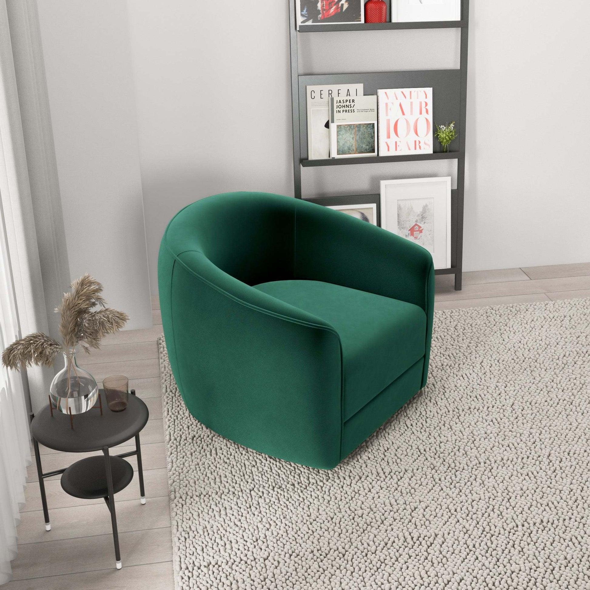 Modern green velvet accent chair in stylish living room with neutral rug and bookshelf, FredCo International furniture
