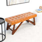 Mid-century modern tufted leather bench with wood frame in stylish living room, FredCo International furniture