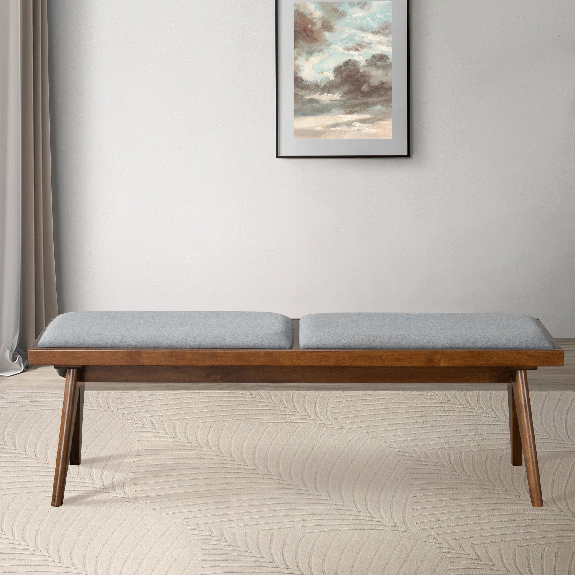 Modern wood bench with gray upholstered cushion in minimalist living room, FredCo International furniture