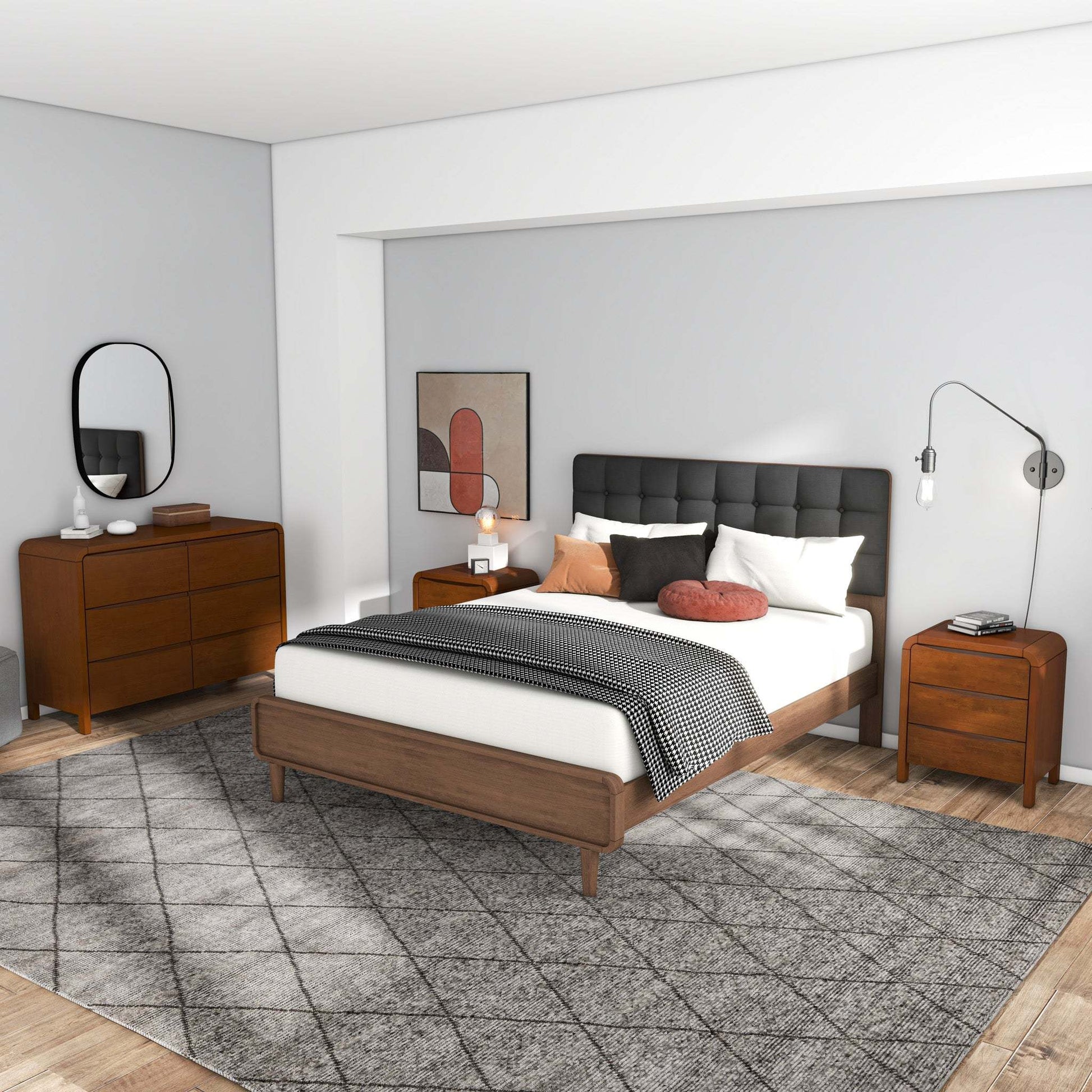 Mid-century modern bedroom with wood bed, dresser, nightstands, grey tufted headboard and decor.