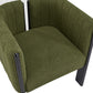 Modern green boucle armchair with black metal legs, contemporary home furniture at FredCo International
