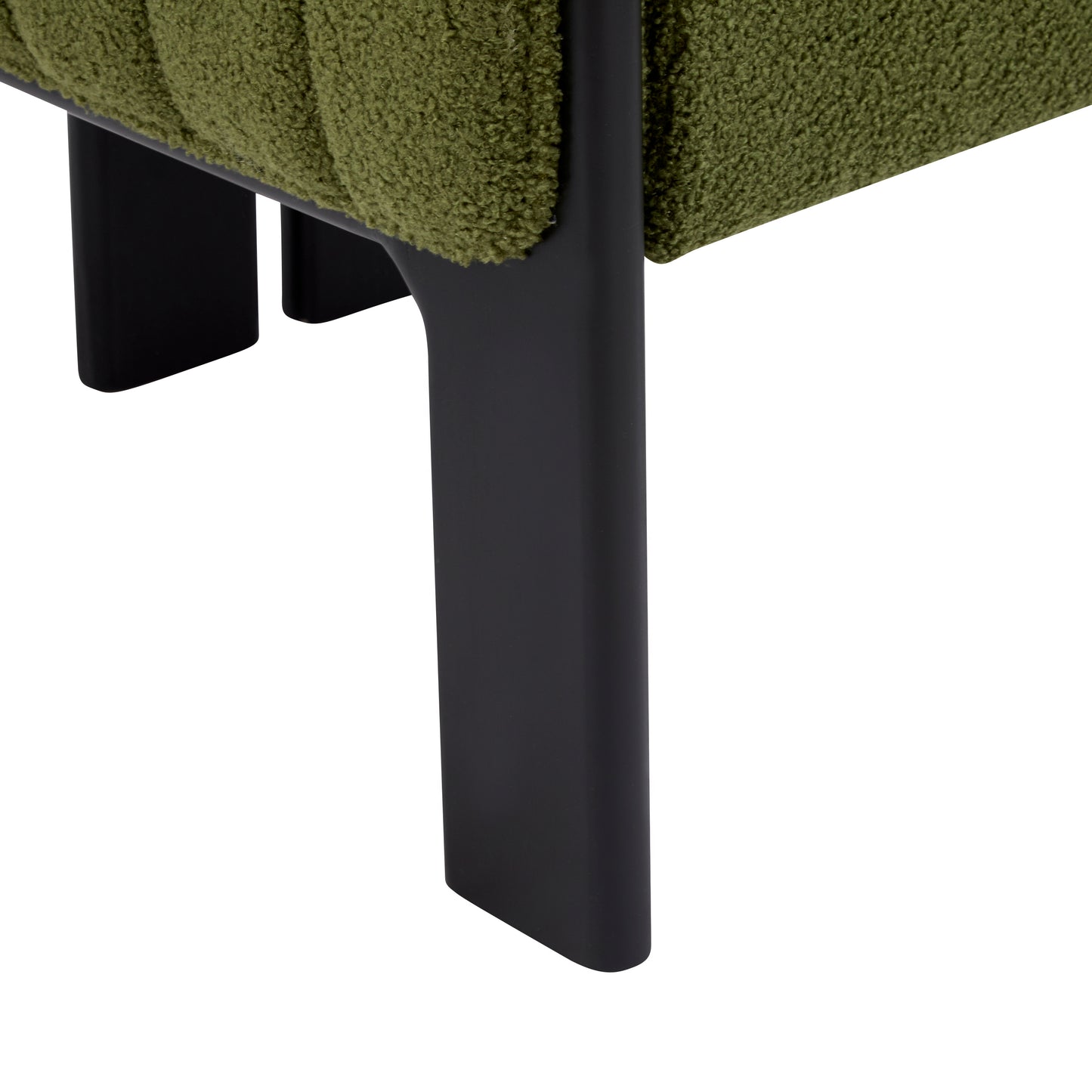Close-up of green upholstered furniture with black metal legs from FredCo International