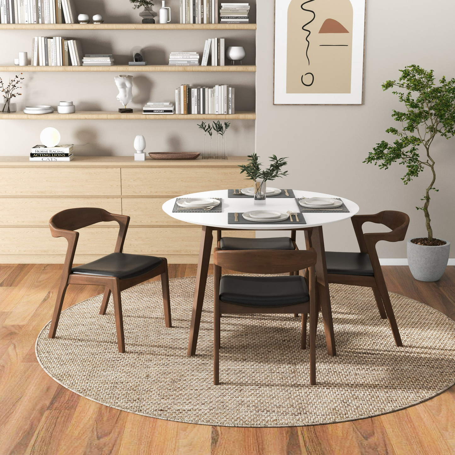 Modern dining room with round table and four chairs on woven rug, minimalist decor, FredCo International furniture