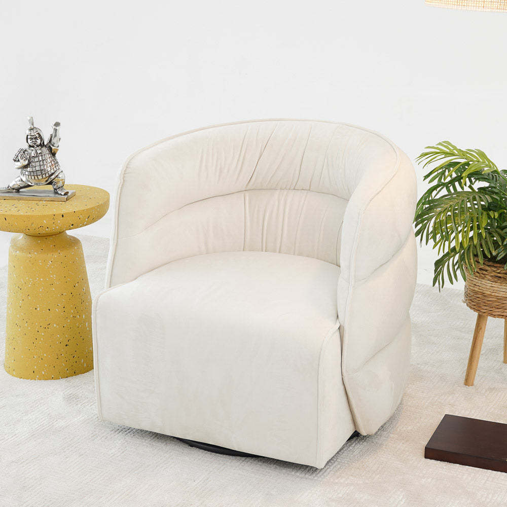 Modern cream swivel accent chair with round yellow side table and indoor plant, FredCo furniture