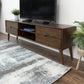 Mid-century modern wooden TV stand with storage drawers in a living room, FredCo International furniture