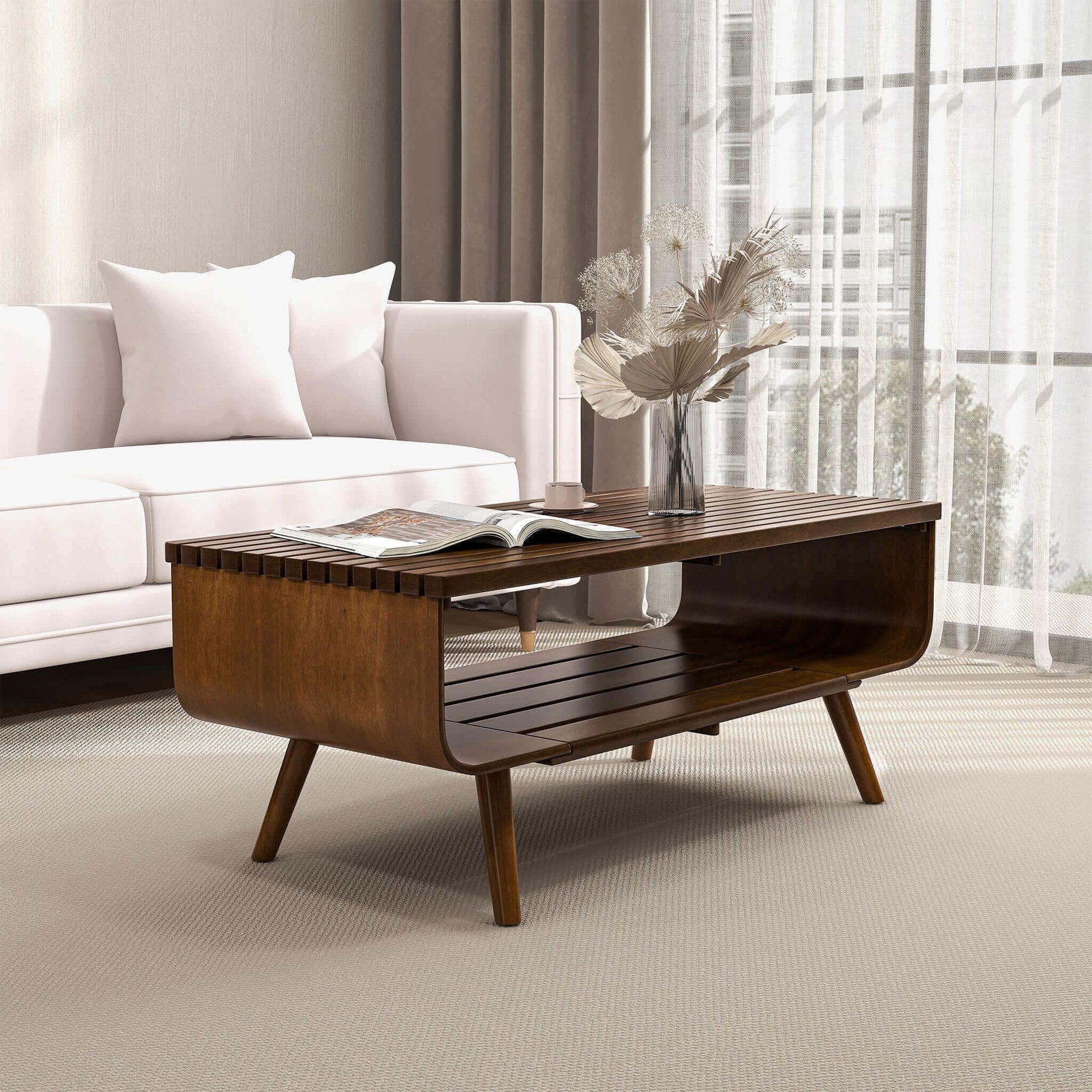 Modern wooden coffee table with vase and magazine in stylish living room with white sofa