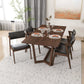 Modern rectangular wooden dining table set with four black cushioned chairs in stylish home décor