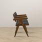 Modern wooden armchairs with black cushions, side view, on light chevron wood floor
