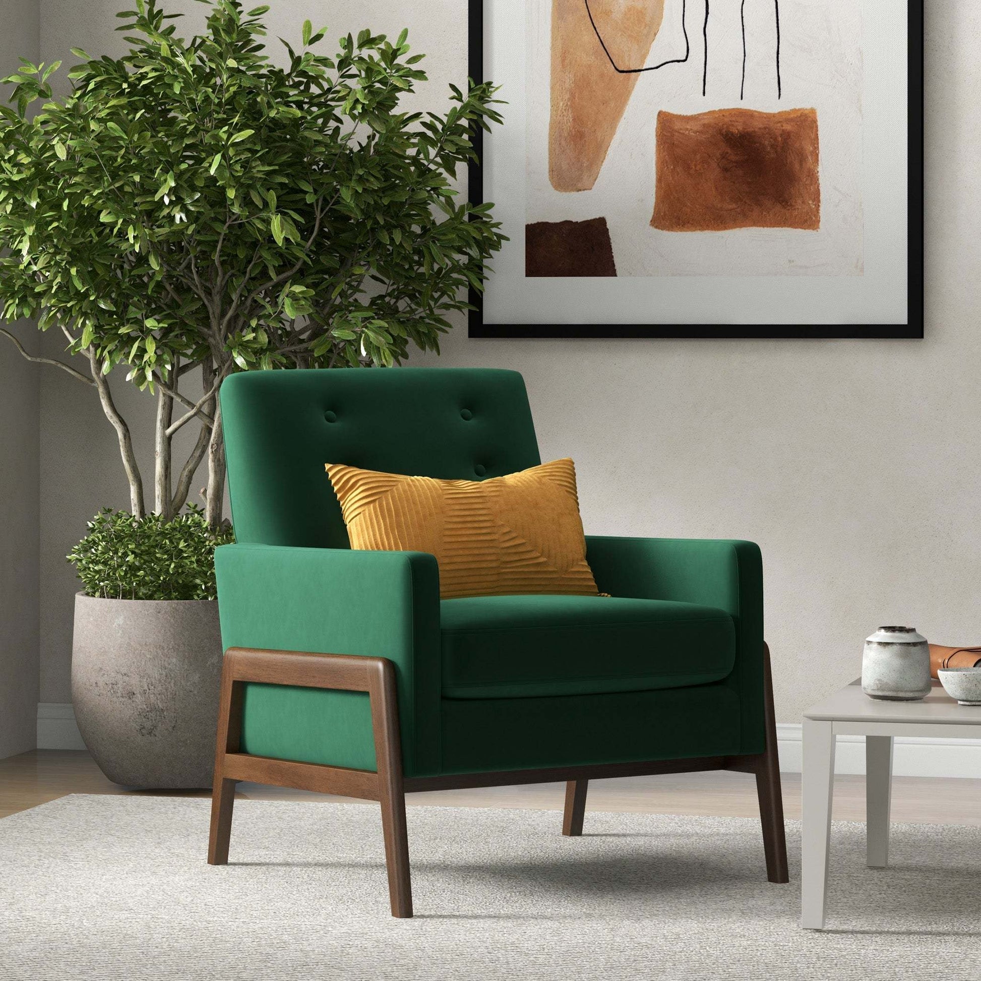 Green accent chair with yellow pillow in modern living room, potted plant, abstract wall art, FredCo International furniture