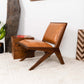 Modern tan leather accent chair with wood frame in stylish living room, FredCo International furniture