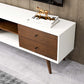 Modern wooden sideboard with white frame, decorative books, and gold horse sculpture