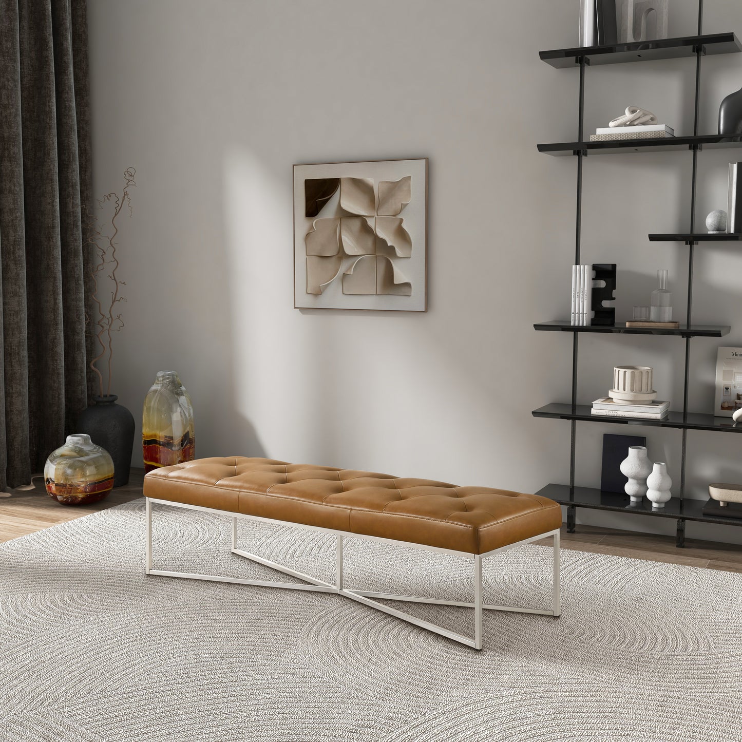 Modern tufted leather bench with metal legs in a stylish living room, FredCo International furniture.