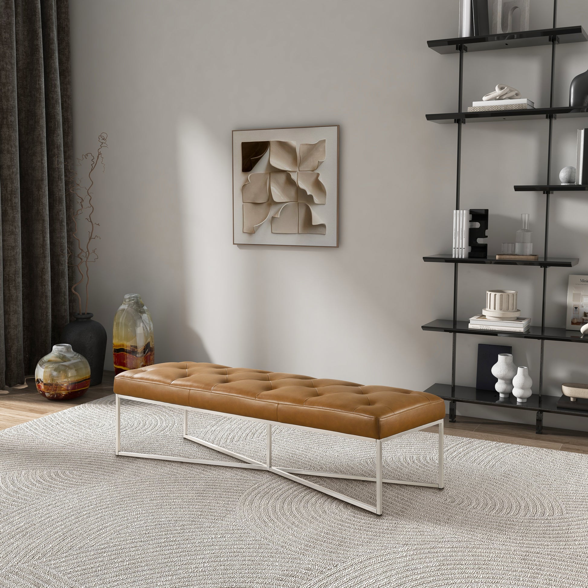 Modern tufted leather bench with metal legs in a stylish living room, FredCo International furniture.