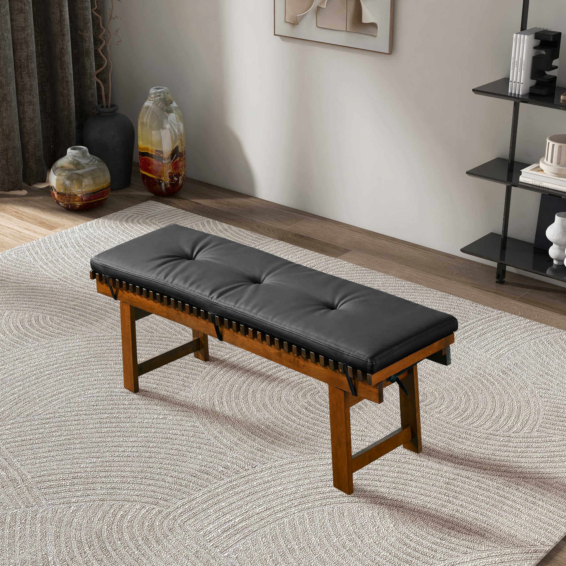 Modern wooden bench with black tufted cushion in stylish living room, FredCo International furniture