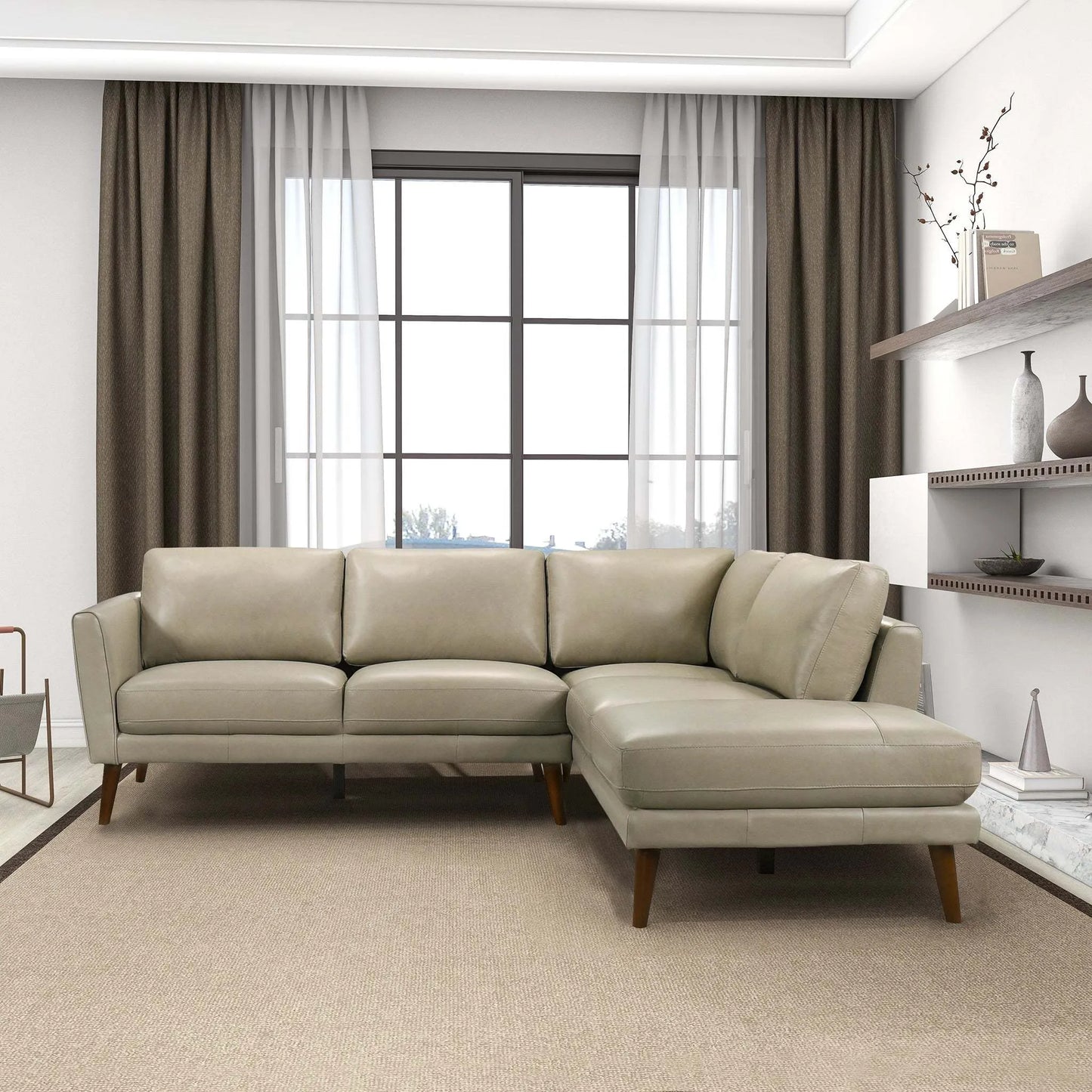 Modern beige sectional sofa in bright living room with large window and minimalist decor
