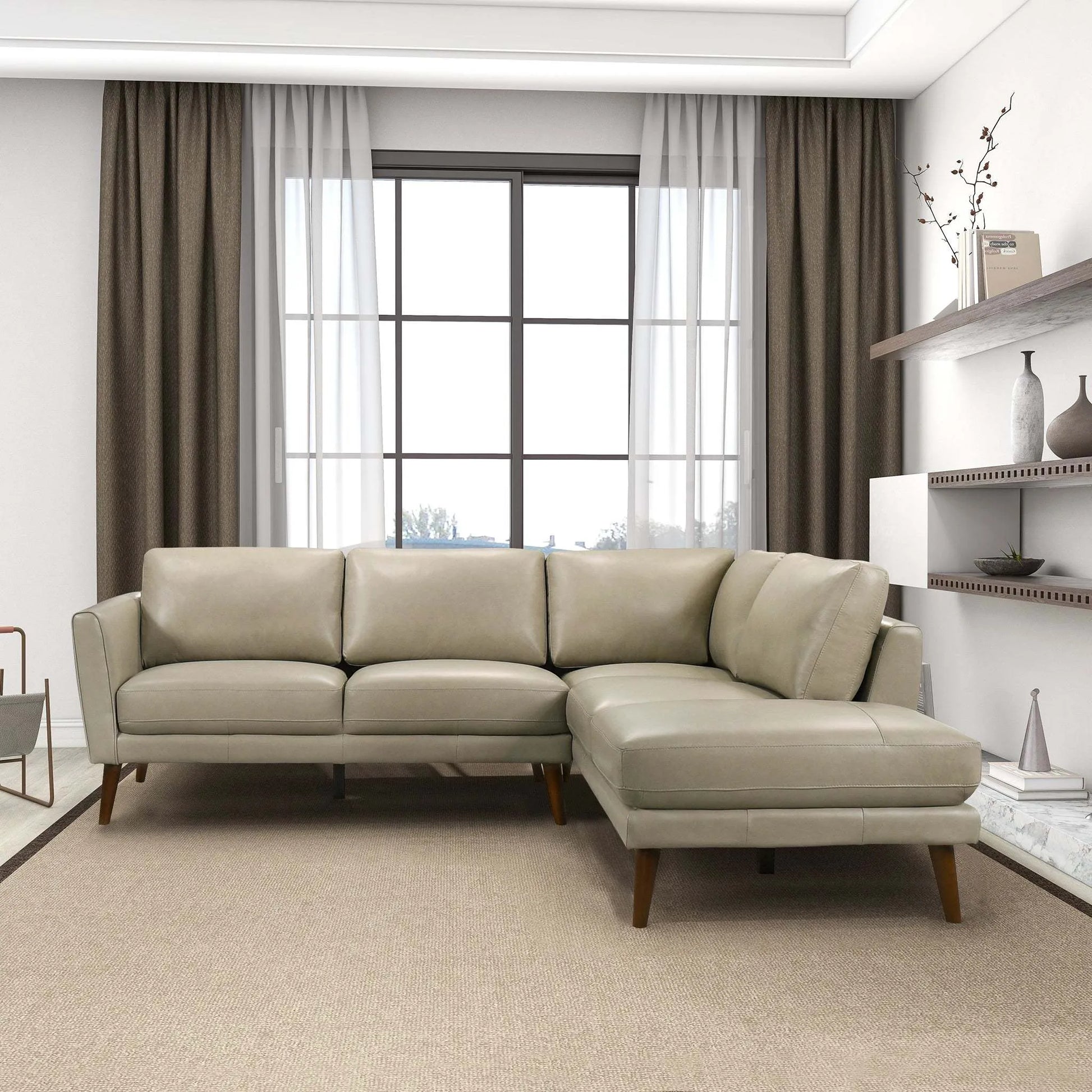 Modern beige sectional sofa in bright living room with large window and minimalist decor