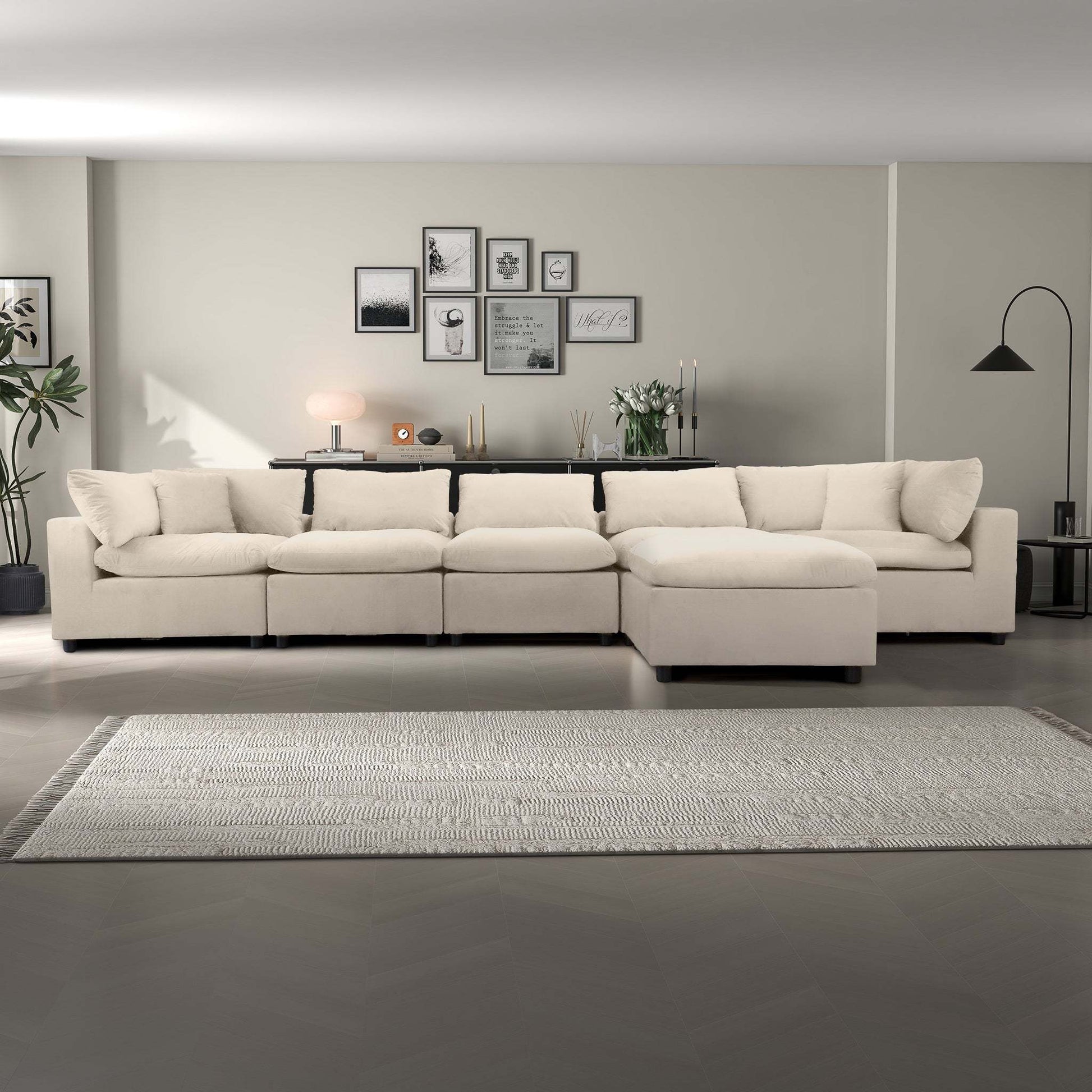 Modern beige sectional sofa in a stylish living room with wall art and decor, FredCo International furniture