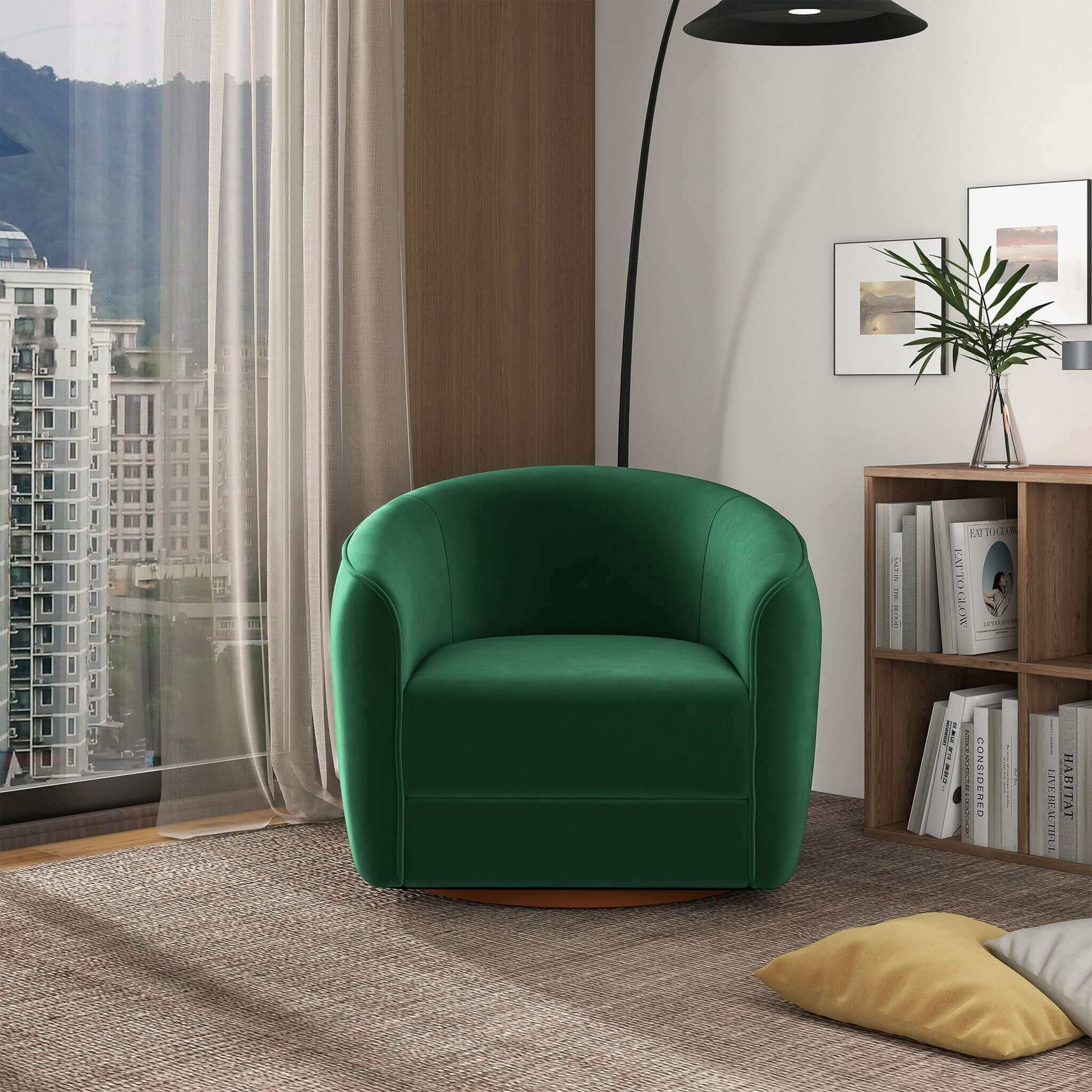 Modern green accent chair in cozy living room with city view, bookshelf, and floor lamp