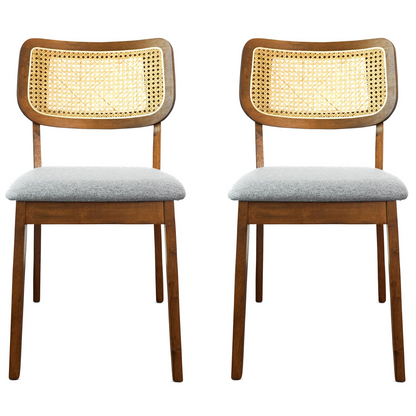 Pair of modern wooden dining chairs with cane backs and light gray upholstered seats