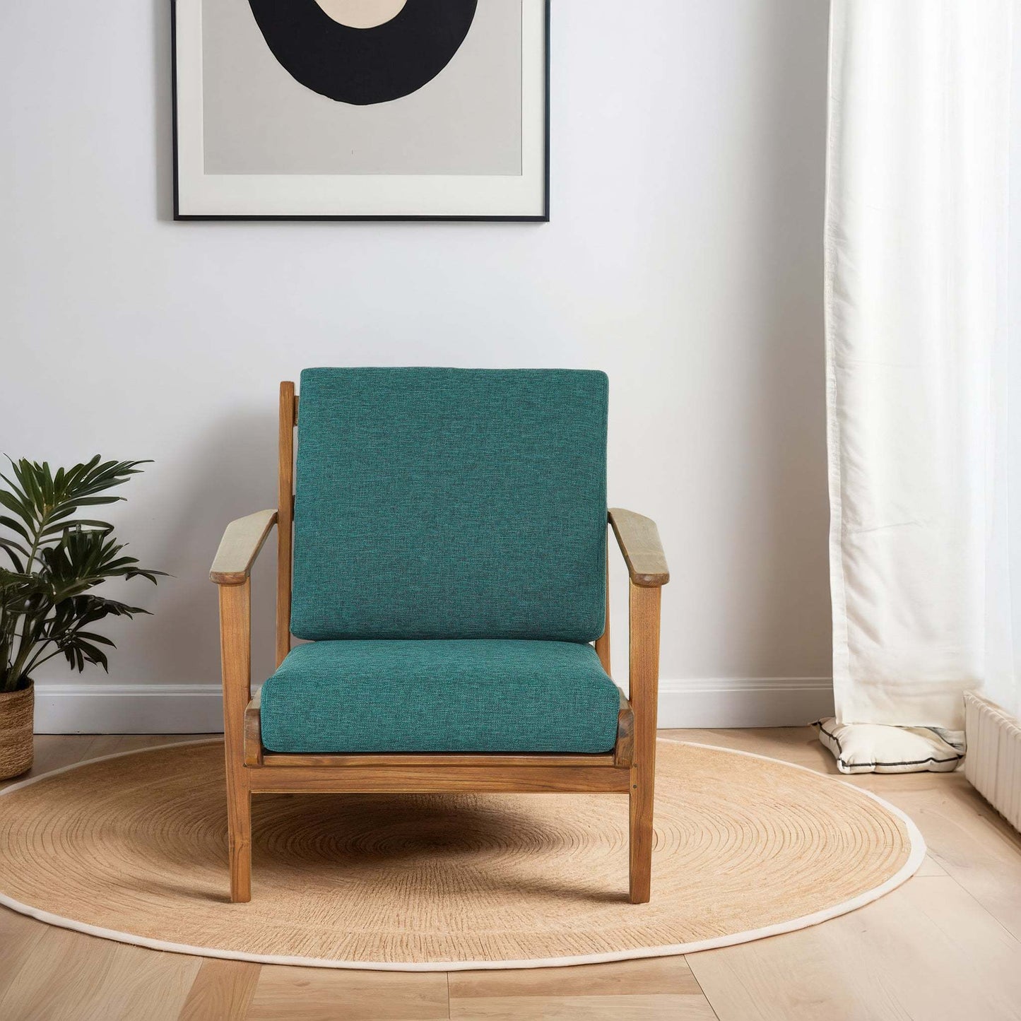 Modern teal armchair with wooden frame in a minimalist living room, FredCo International furniture