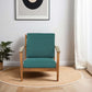 Modern teal armchair with wooden frame in a minimalist living room, FredCo International furniture