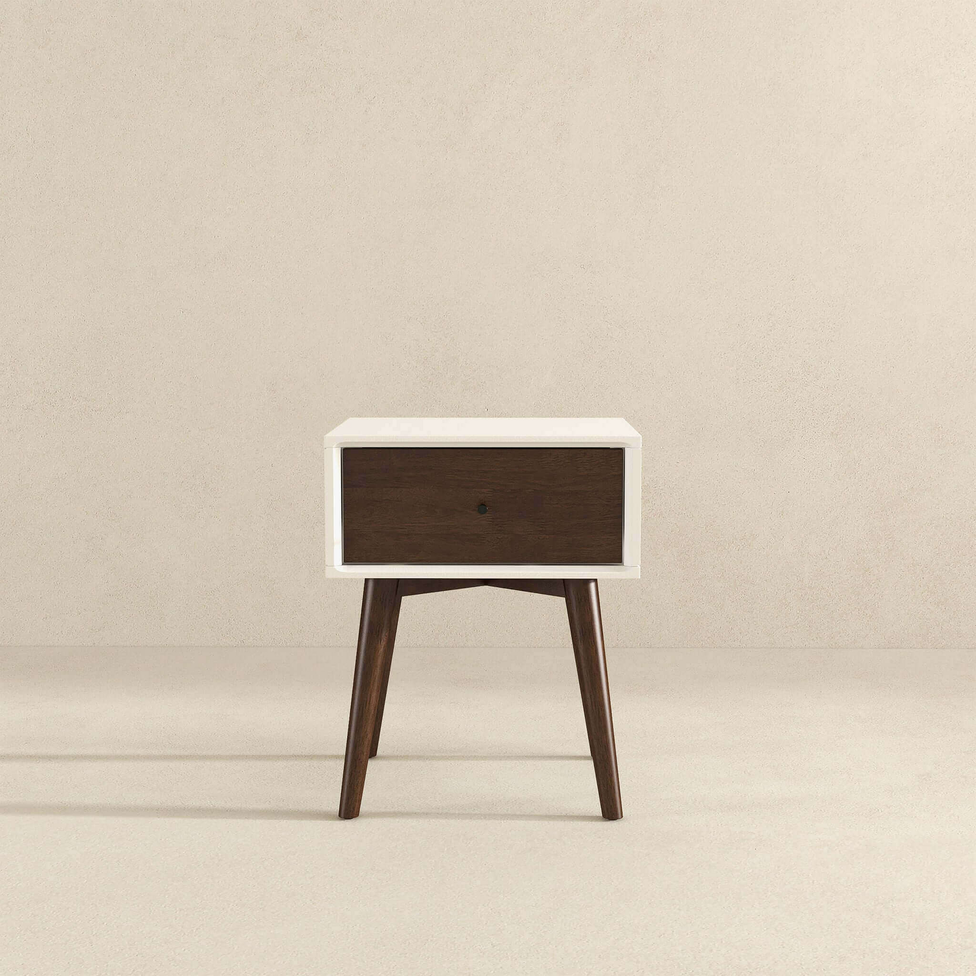 Mid-century modern wooden nightstand with white frame and single drawer on light background