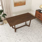 Modern wooden dining table in a minimalist living room with rug and décor, FredCo International furniture