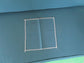 Teal fabric sample with stitched square swatch, FredCo International furniture upholstery.