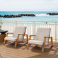 Modern wooden outdoor lounge chairs on a deck overlooking the ocean, FredCo International furniture