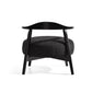 Modern black accent chair with curved backrest and cushioned seat on white background