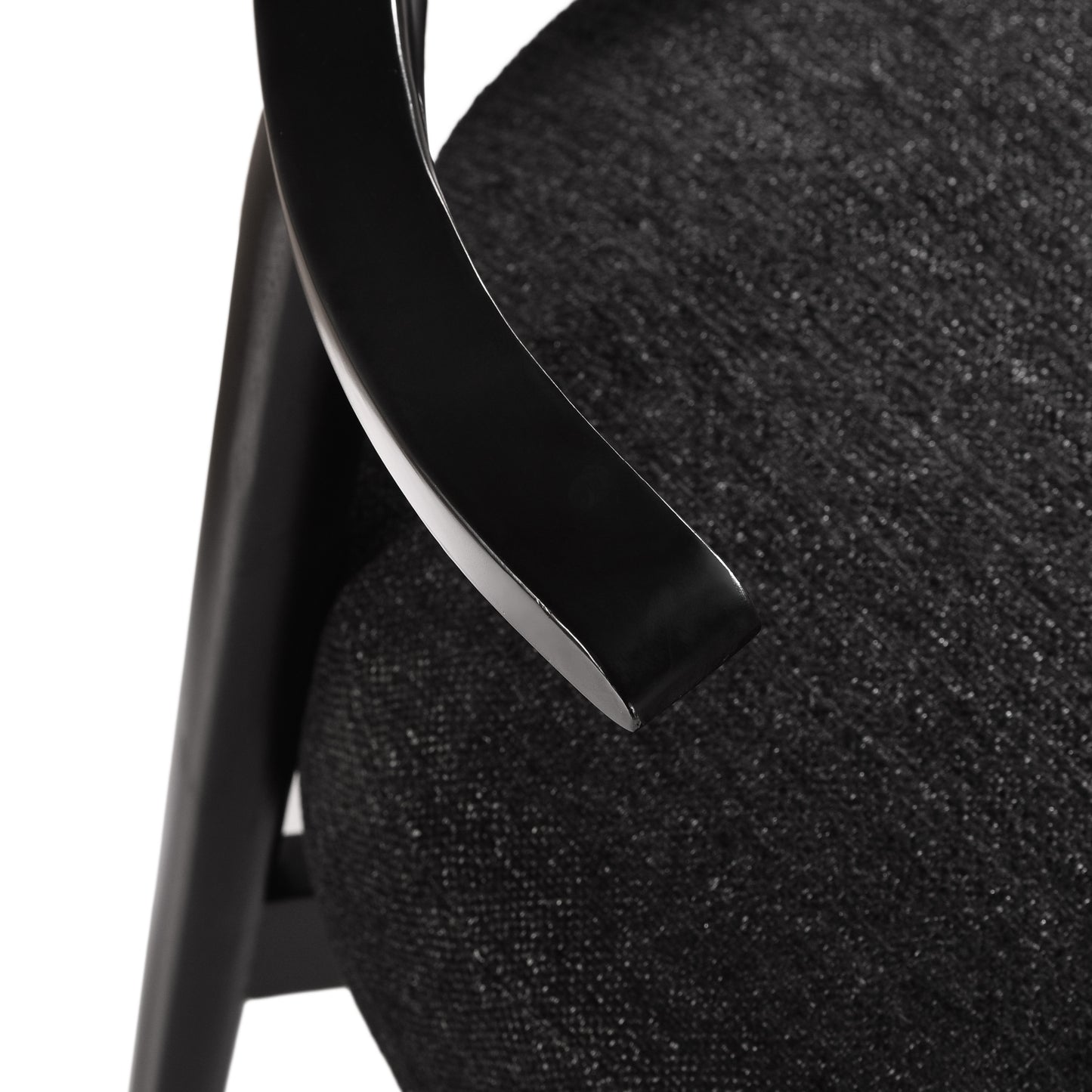 Close-up of modern black upholstered chair arm and seat from FredCo International furniture