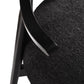 Close-up of modern black upholstered chair arm and seat from FredCo International furniture