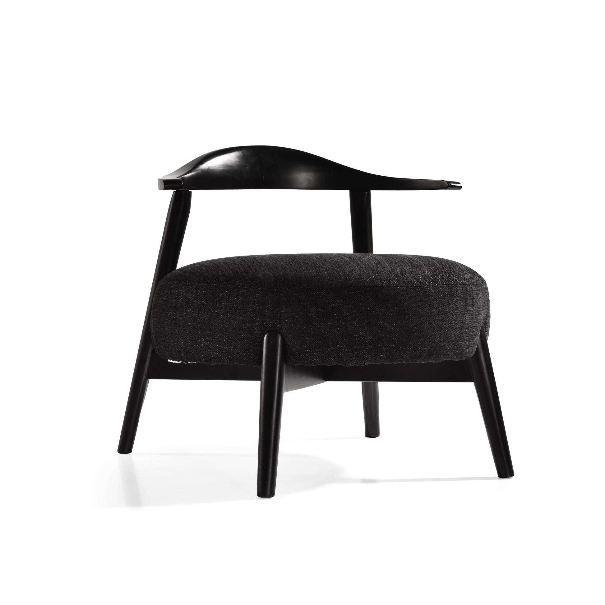 Modern black accent chair with curved wood backrest and dark upholstered seat, FredCo International furniture