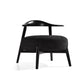 Modern black accent chair with curved wood backrest and dark upholstered seat, FredCo International furniture