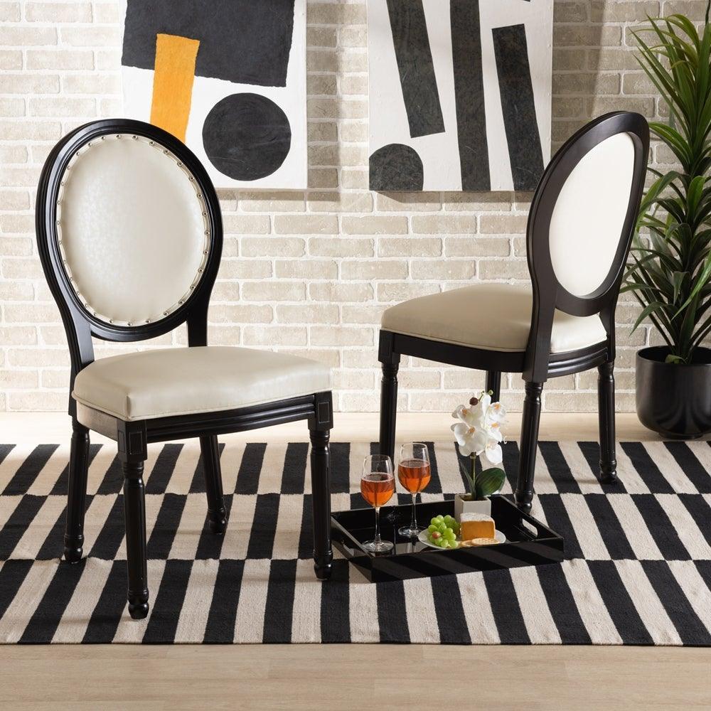 Louis Traditional French Inspired Beige Faux Leather Upholstered and Black Finished Wood 2-Piece Dining Chair Set FredCo